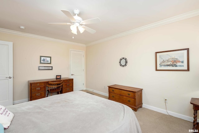 carpeted bedroom with ceiling fan, ornamental molding, and a closet