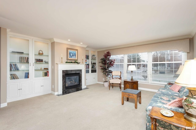 carpeted living room featuring a fireplace and ornamental molding