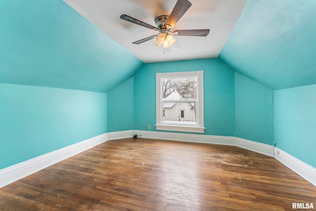 additional living space featuring dark hardwood / wood-style floors, ceiling fan, and lofted ceiling