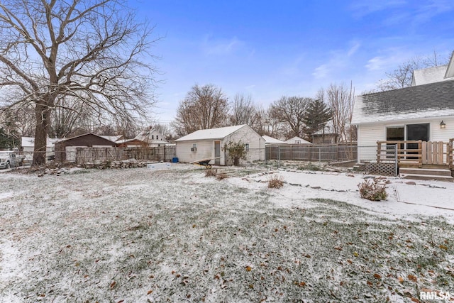 yard covered in snow with a wooden deck