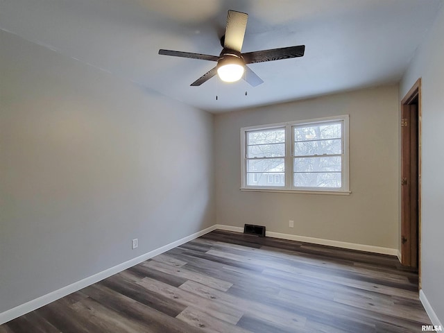 spare room with hardwood / wood-style flooring and ceiling fan