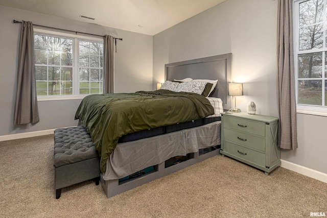 bedroom with light carpet