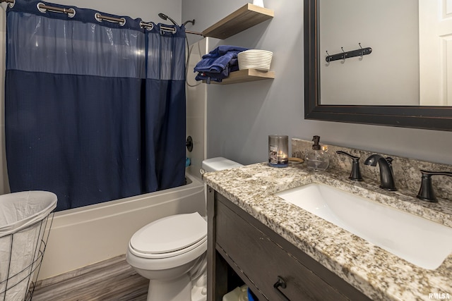 full bathroom with toilet, vanity, shower / tub combo, and hardwood / wood-style flooring