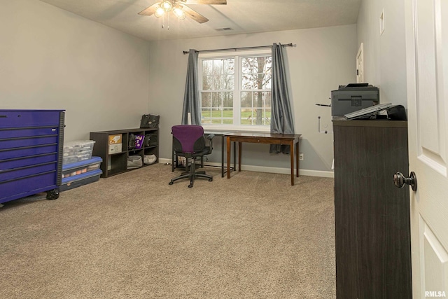 carpeted office with ceiling fan