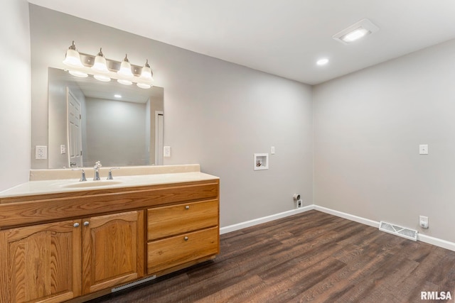 bathroom featuring vanity and hardwood / wood-style flooring