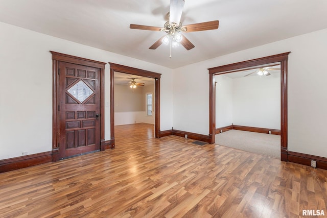 foyer entrance featuring hardwood / wood-style floors and ceiling fan