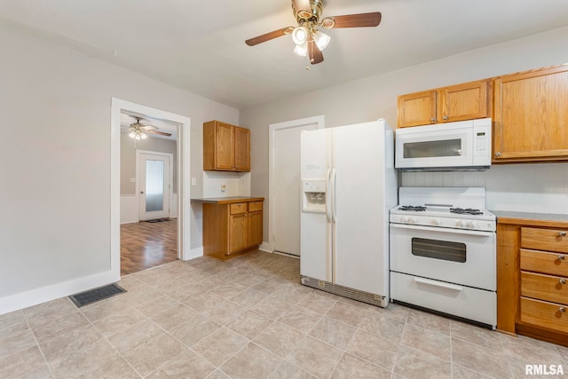 kitchen featuring ceiling fan and white appliances