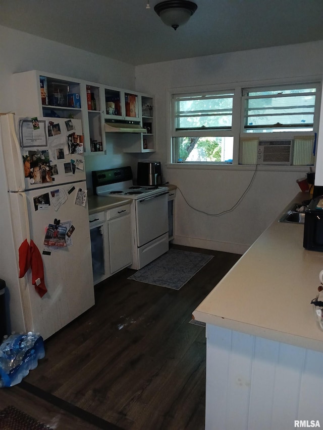 kitchen with white cabinets, dark hardwood / wood-style flooring, white appliances, and cooling unit