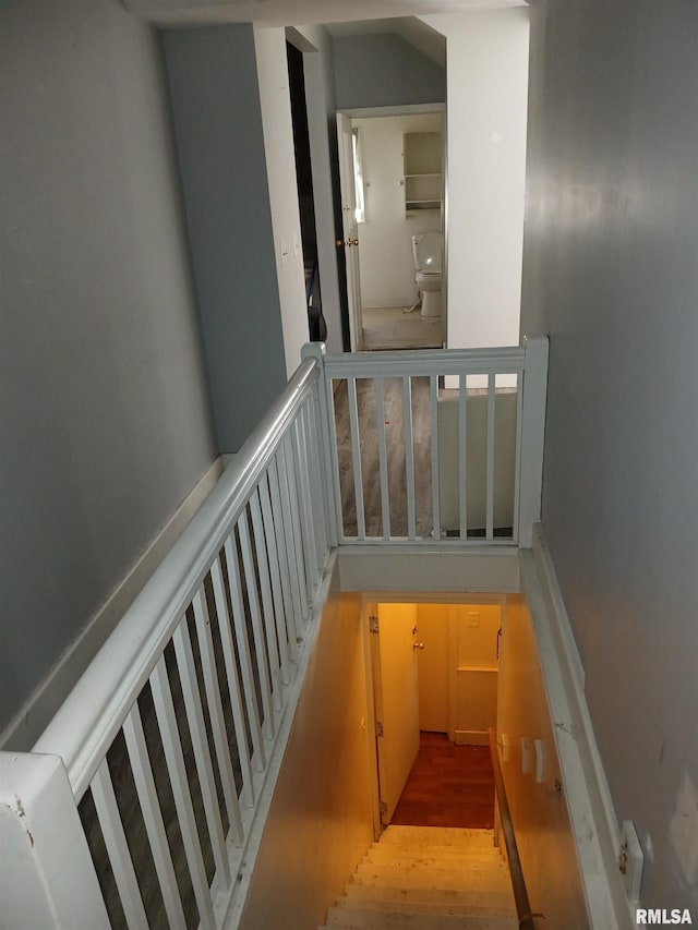 stairs with hardwood / wood-style floors