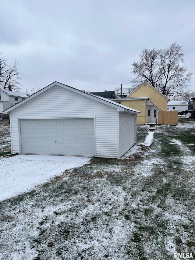 view of snow covered garage