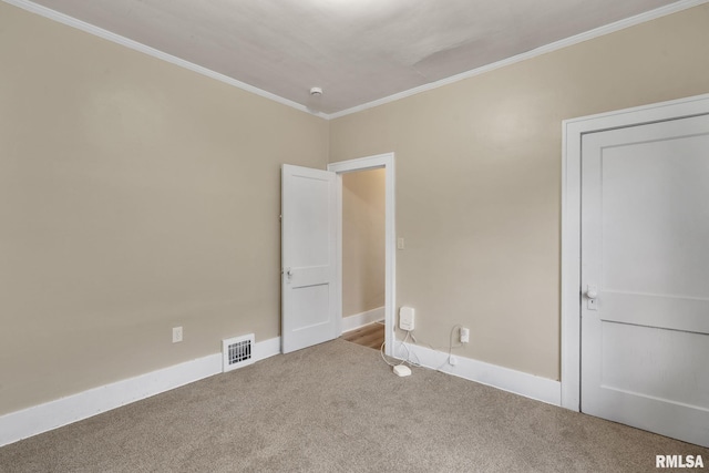 interior space featuring crown molding and carpet floors