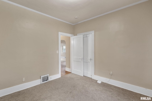 interior space featuring carpet and ornamental molding