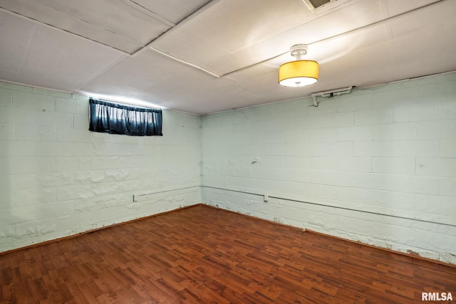 basement featuring hardwood / wood-style flooring