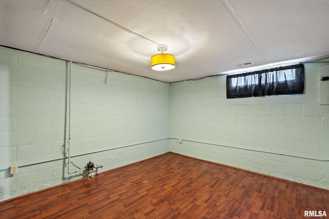 basement featuring wood-type flooring