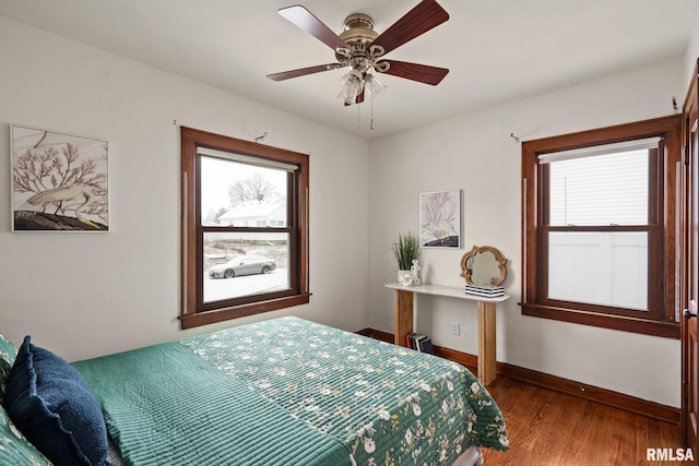 bedroom featuring hardwood / wood-style flooring and ceiling fan