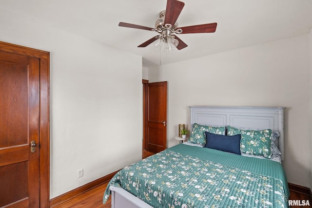 bedroom featuring ceiling fan and wood-type flooring