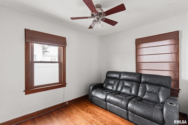 living room featuring hardwood / wood-style flooring and ceiling fan