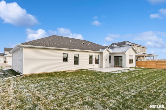 back of house featuring a yard and a patio area