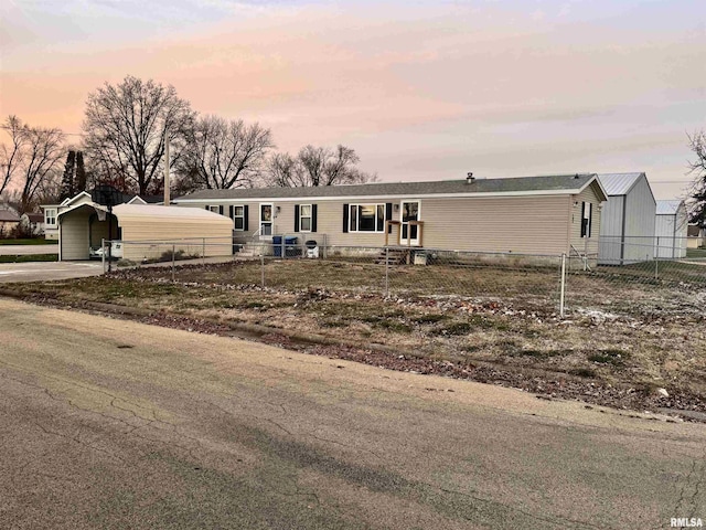 view of front of home featuring a carport