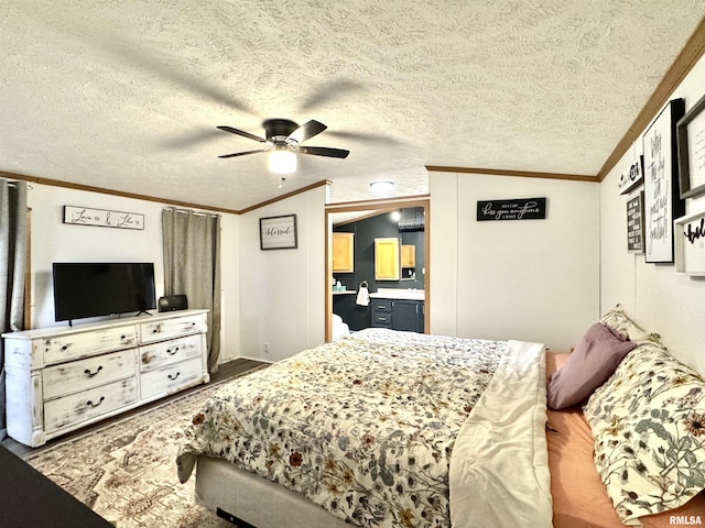 bedroom featuring lofted ceiling, crown molding, ceiling fan, a textured ceiling, and connected bathroom