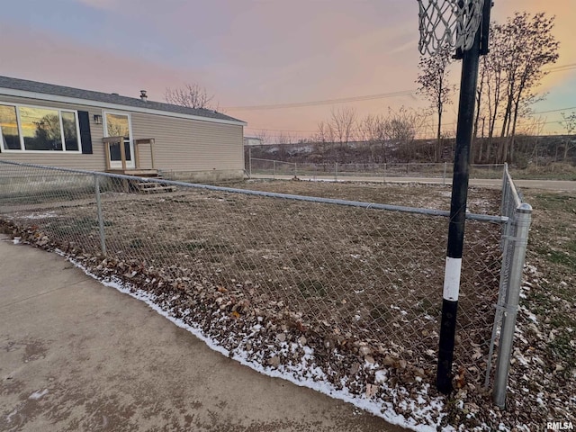 view of yard at dusk