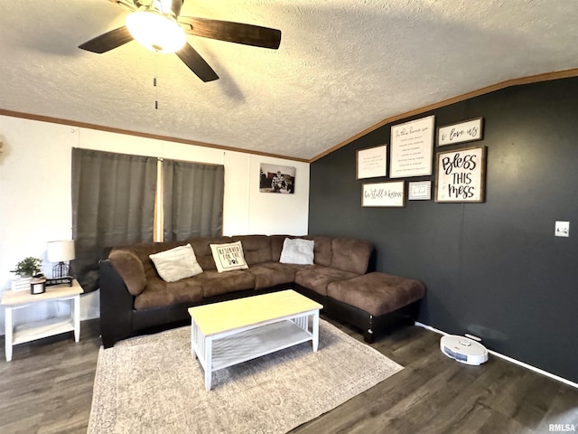 living room featuring dark hardwood / wood-style floors, ornamental molding, a textured ceiling, and vaulted ceiling