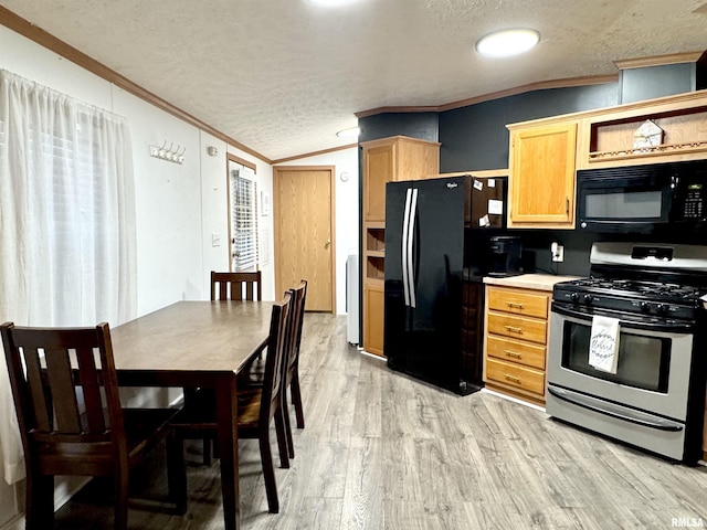 kitchen featuring a textured ceiling, light wood-type flooring, crown molding, and black appliances