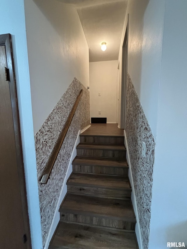 stairway featuring wood-type flooring