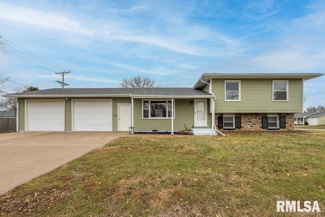 tri-level home with a garage and a front lawn