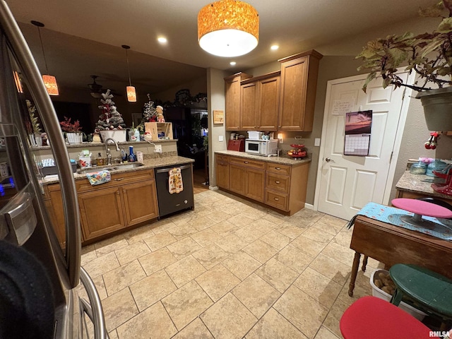 kitchen featuring sink, dishwasher, light stone countertops, decorative light fixtures, and kitchen peninsula