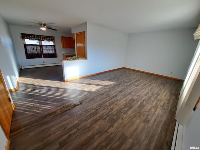 unfurnished living room featuring dark hardwood / wood-style flooring, baseboard heating, and ceiling fan