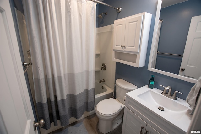 full bath featuring shower / tub combo with curtain, vanity, and toilet