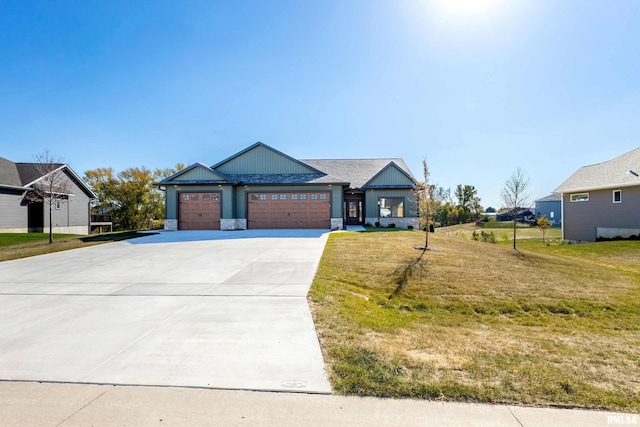 view of front of house with a front lawn and a garage