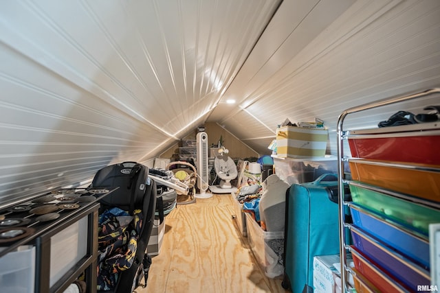 interior space with wood-type flooring and vaulted ceiling