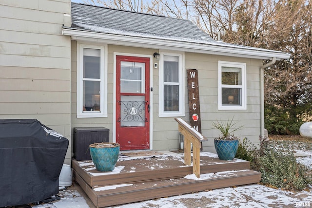 view of snow covered property entrance