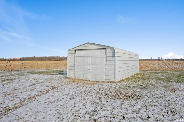 view of outbuilding with a rural view