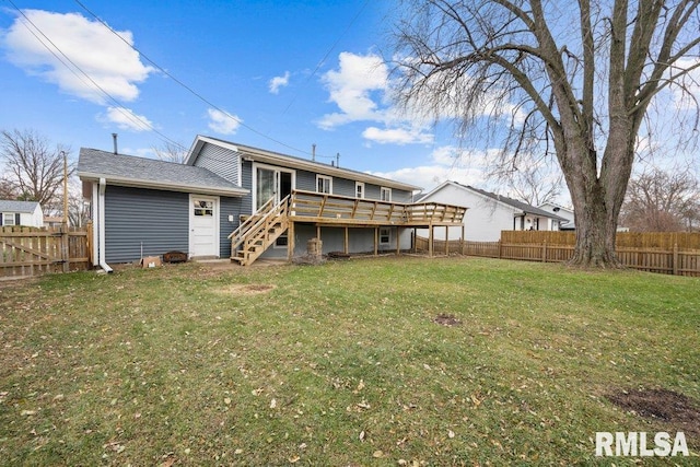 rear view of property with a lawn and a deck