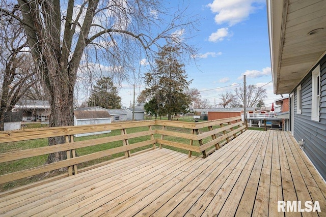 wooden deck with a yard