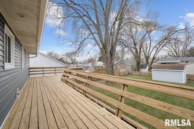 wooden terrace with a shed