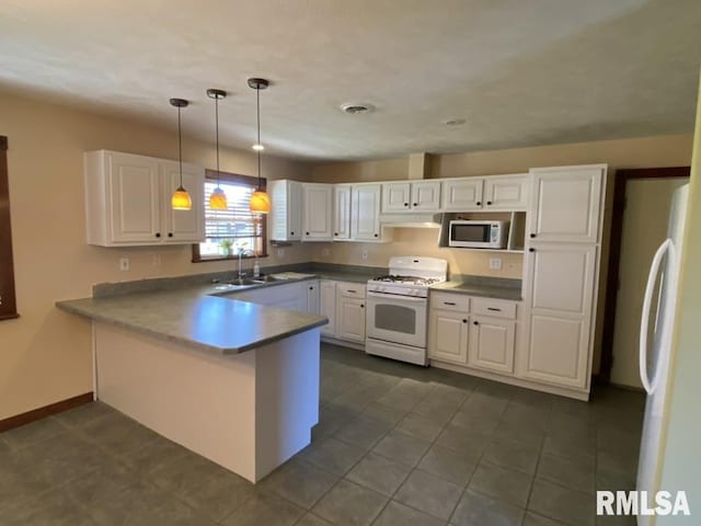 kitchen with sink, white cabinets, pendant lighting, and white appliances