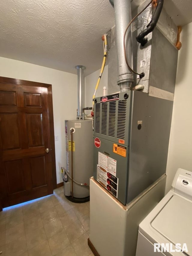 utilities featuring gas water heater and washer / dryer