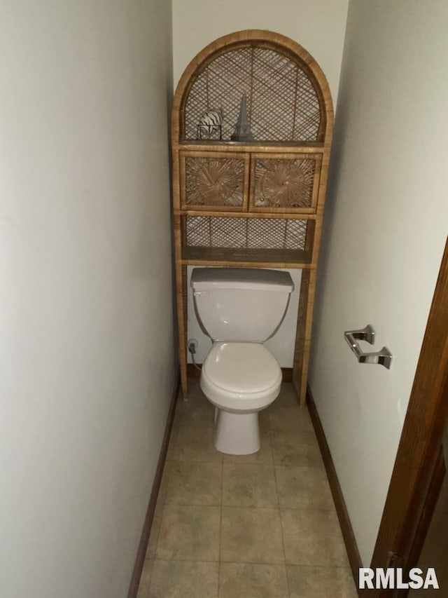 bathroom featuring tile patterned flooring and toilet