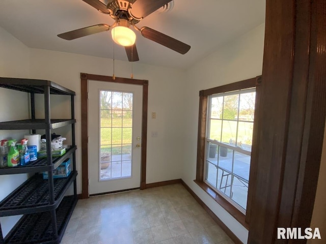 doorway with ceiling fan