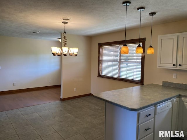 kitchen with kitchen peninsula, decorative light fixtures, hardwood / wood-style flooring, dishwasher, and white cabinetry