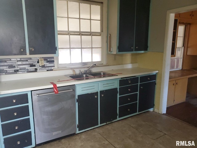 kitchen featuring dishwasher, light tile patterned floors, sink, and tasteful backsplash