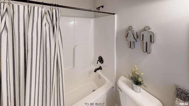 bathroom featuring shower / bath combination with curtain and toilet