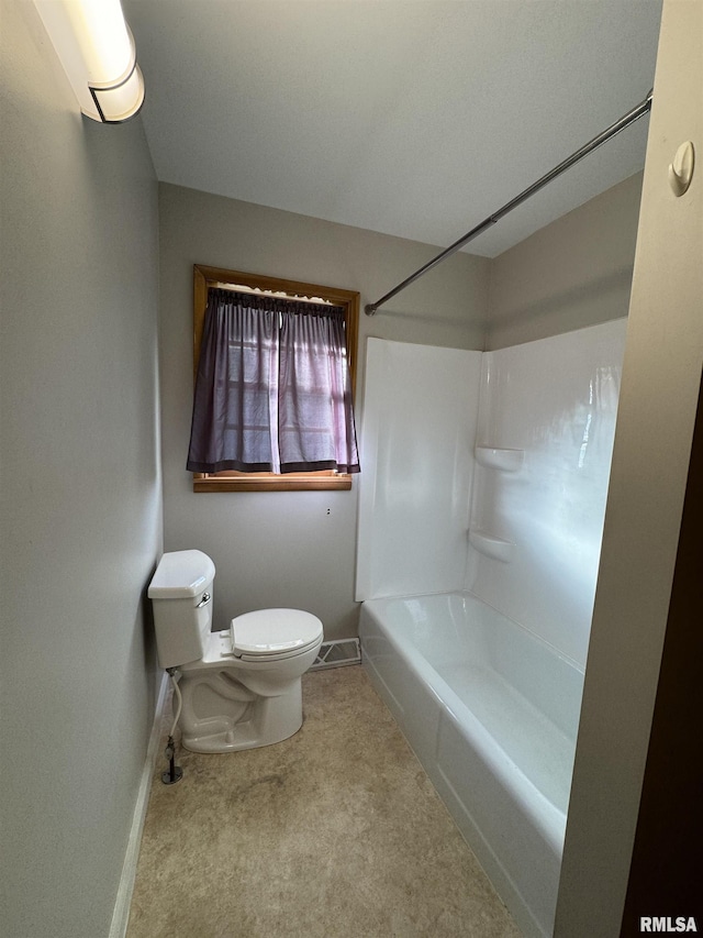 bathroom with toilet and tub / shower combination