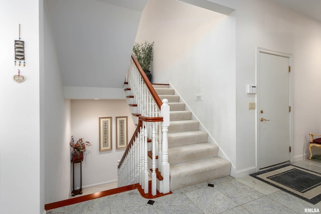 foyer with a towering ceiling