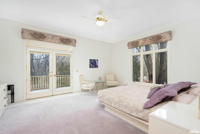 bedroom with ceiling fan, light carpet, access to outside, and french doors