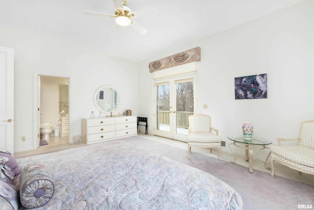 carpeted bedroom with access to exterior, french doors, connected bathroom, and ceiling fan